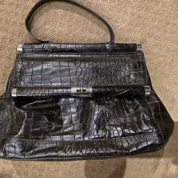 Crocodile effect , dark brown leather handbag from the Marks and Spencer Portfolio range. Studded bottom. Only used a couple of times. Inside has a front pocket for a phone , centre and back zip pocket. ( Was £85 new )