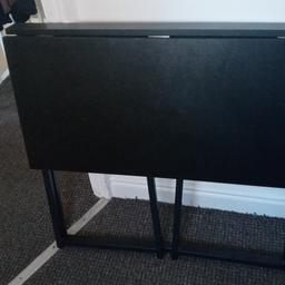 Black desk that you can fold away when not in use