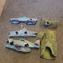 fish tank ornaments, submarine, boat, plane, and 2 log caves. 30 quid or make me a offer.