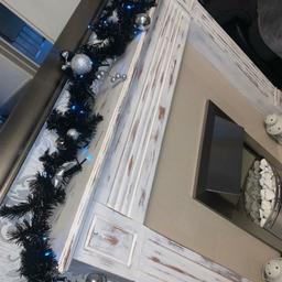 5ft black and silver garland with blue multi function lights. It is thicker than looks on pics. Only selling due to change of colour scheme.