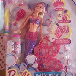 Barbie doll that makes bubbles. brand new unopened. great for Christmas.
