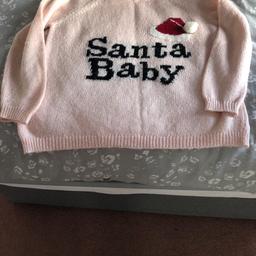 Good used condition. Size 12 but oversize so could also fit size 14. Santa Baby from River Island.