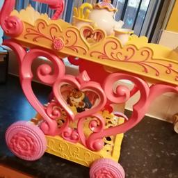 Beauty and the beast tea trolley. Has tea set and centre spins and has be our guest melody.