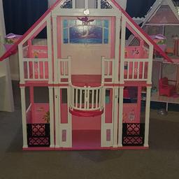 Barbie dream house. 
The lift at the front moves up and down. The back drop changes from day to night. The sides come off and can go together. Well loved but loads of life left  in it