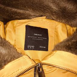 Lovely coat I just don’t wear it anymore. 
Zara size XL. Approx 12-14.
Yellow with fur collar and has a concealed zipped away hood.