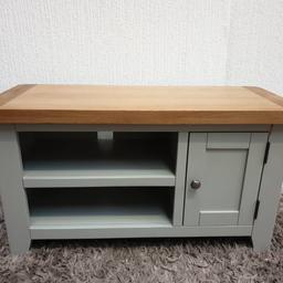 Ex display item in great condition, very strong, clean.

made of oak.
H51 W91 D37 cm.
has 2 fixed shelves inside.
chunky oak top.
GREY painted.
ex display, original price is £179.99.
has crack on the leg, please have a look at the photo.

Local delivery available for extra charge.
Viewing & Collection is from SPALDING Lincolnshire PE113PE.
Cash on collection or delivery is preferred. Thanks.