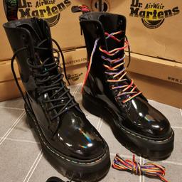 Dr Martens Jadon Hi

Black Rainbow Patent Leather Platform Boots

Size 6 UK.

Come with original box and all packaging. Also with black, and rainbow coloured laces. Rainbow coloured stitch around the welt.  Where the patent leather shines, its in a rainbow colour. 

Boots have been worn once. Some minor marks around the toes as can be seen in the photos, there is minimal wear on the heel, consistent with the time worn. Selling as new with defects, if you don't agree, don't buy.