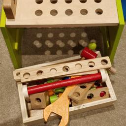 a lovely set of wooden toolbox play set consisting of big screws, nuts, spanner, wooden planks etc. no sharp edges and corners so very safe for little ones
