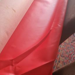 red vinyl  frabic for upholstery.  originally  used for making car seat cover  but no longer need it, really  high quality frabic can be used for sofa's and chairs. 

pick up only because its heavy.