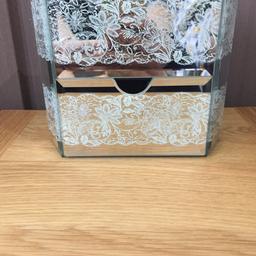 Laura ashley jewellery box in great condition with a lace pattern all the way around the box.
Contains two pull-out drawers. originally £32
Small mark on the top of the glass not very noticeable this is how it was when bought it is not crack.
Would make a lovely Christmas present
In great condition.
Open to offers collection preferable just because I cannot guarantee how it will arrive if posted.