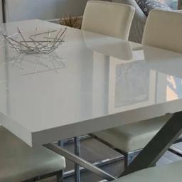 Solid, white large dinning table, could be extended
( Chairs Not included seen pictures)