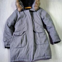 grey fully lined and padded with down and feather coat used twice fur around hood, cuffs can be adjusted to fit your wrist size , zip up front with added poppers fastening, 2 pockets on front with poppers, thick heavy warm coat , by mountain warehouse "extreme 600" women's coat rpp £219.00,, only been worn twice ,can post or local delivery, still available as of 15/12/2020, absolute bargin, beautiful coat, is a bit lighter in colour than the pics show