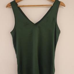 Brand new beautiful forest green silk front and cotton back top.
Size small. I have taken out the label but it has
never been worn. Bought for £80