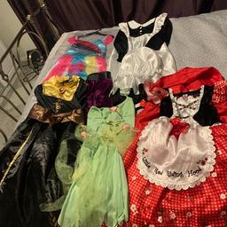 Red Riding Hood 7-8 years 
Maid Outfit with bonnet - 7 - 8 years 
Unicorn Outfit - 5 - 7 years 
Ticker bell Outfit - 8 - 10 years but comes up small 
Anna - 8 -9 years 

All it good condition like new , only worn once.