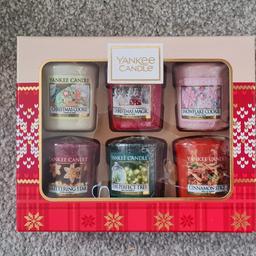 Brand new Yankee Candle gift set. 

Contains 6 christmas scented votives. Including;
- Christmas cookie
- Christmas magic
- Snowflake cookie
- Cinnamon stick
- The perfect tree
- Glittering star

Collection from WHEATLET HILL

WONT POST.