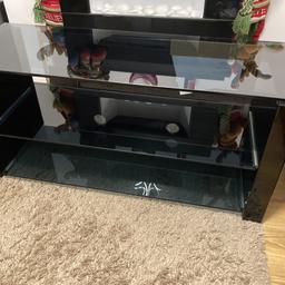 Gloss tv cabinet with glass shelves,
bought from curry’s a few years ago fir £250 .
This is a Very sturdy tv unit and will take a large tv (we had a 55”) but will take a bigger
Approx measurements are 110 long 40 width and 50 high

In good condition , couple of chips but not really noticeable and could be covered using a high glass nail varnish.
Only selling as bought a bigger one.
Will be dismantled over next few days as need the space.,