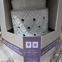Brand new, ceramic Yankee wax melter. Electric, so no flame needed. This does have an EU plug so will need an adapter for use in the UK.