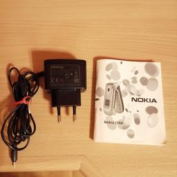 Original Ladegerät für Handy Nokia 2760 + Bedienungsanleitung. Gerät und Kabel vollfunktionsfähig ohne Beschädigungen.