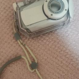 Mini digital camera with case. Unfortunately I can't find the charger but still looking for it.