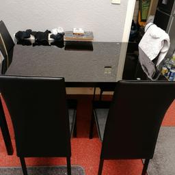 Black glass top dining table 1200x 800 and 4 x black chairs good condition now dismantled for collection ONLY, stop asking will i deliver it for 70 pence ! collection windermere rd m24