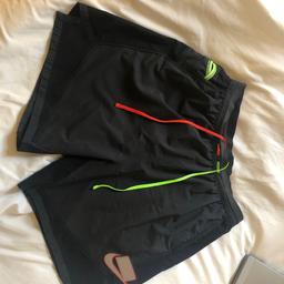 Nike shorts 
Dri fit 
Amazing looking shorts 
Zip pocket in back 
Very comfy shorts 
Size large men