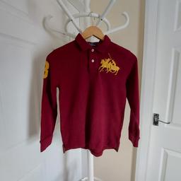 Shirt "Polo by Ralph Lauren" Dark Burgundy Colour
Good Condition

Actual size: cm

Length: 51 cm front

Length: 55 cm back

Length: 33 cm – 36 cm from armpit side

Shoulder width: 36 cm

Length sleeves: 50 cm

Volume hands: 31 cm

Breast volume: 78 cm – 84 cm

Volume waist: 78 cm – 84 cm

Volume hips: 78 cm – 85 cm

Size: M , 10 -12 Years (UK )

100 % Cotton

Exclusive of Decoration

Made in Peru