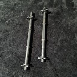 A pair of dumbbell spinlock bars. Excellent condition. Extra long to hold extra weight. Includes spinlocks.
