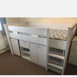 Seconique Merlin Study Mid Sleeper in white.
H116.5 x W202 x D103.
Solid & Sturdy wooden slatted bed In very good condition.
Compact with plenty of storage and a pullout desk.There is also the bonus of additional space under the bed which can be used as a den or additional storage space.
Pull out desk H71 x W92 x D40.5
Under the bed is another storage unit with more shelves, a drawer and a cupboard.
Behind the ladders are even more shelves.
Single Spring Mattress also included.