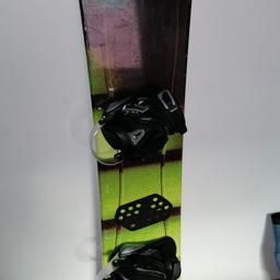 Stuf Snowboard with atomic bindings. 155cm long and in good condition.