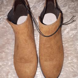 suede effect tan coloured boots
brand new