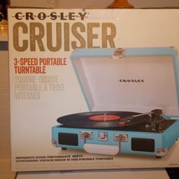 A CROSLEY CRUISER 3 SPEED PORTABLE TURNTABLE IN BLUE, BOXED NEVER BEEN USED.