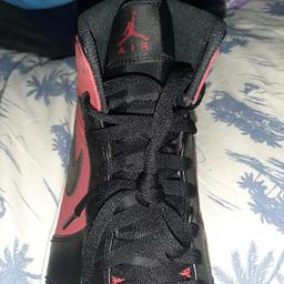 brand new never been worn just the box is damaged red and black air Jordan's 1 mid