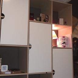 2 units of coax shelving ikea very stron and with white melamine dors very good condition 50 pound pound excuse the rubbish on it or make me.a.reasonable offer
