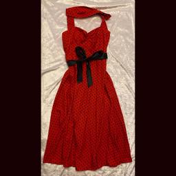 Red 1950s style pinup dress

Red halter neck midi dress with black spots and black satin sash and ruched sweetheart neckline 

Fastens with a zip at the back and halter neck ties

Asian size XL fits a UK medium size 10-14

Open to offers