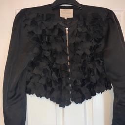 Size: UK 14
Colour: Black
Condition: brilliant condition
Detail: black zip up crop jacket with ruffled front.
P&P £4.10 or free collection 
❌smoke and pet free home❌