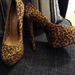 very high heel shoes with platform fronts in leapord skin. size 6 excellent condition.