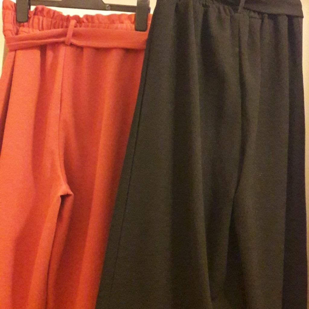 Two pairs of culottes Size 6 with elasticated waist and belt from I saw it first

One pair black and One pair Rust colour

excellent condition
will sell together or individual