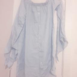 denim look
Long sleeves with ties at the end 
Buttons down the front 
Off the shoulder 
Light Dress
Never been worn