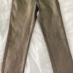 Ladies gold shimmer jeans by next size 12
A nice comfy pair of jeans