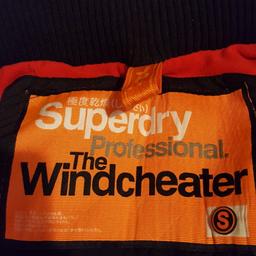 Black Superdry windcheater coat. Size UK S small. Very good clean used condition with plenty of wear left in it 
Treble front zip fastening, hooded fleeced lined