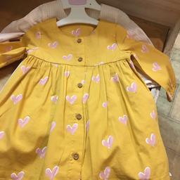 BRAND NEW WITH TAGS 
TWIN PACK COTTON DRESSES 
1 mustard with pink hearts And 1with baby pink pin stripes both with cotton petticoats 
M&S 
3-6 months