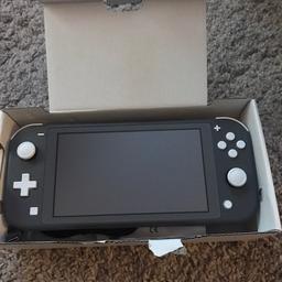 Nintendo switch lite in mint condition it’s colour is grey comes with manual charger and the box it is only 2 weeks old