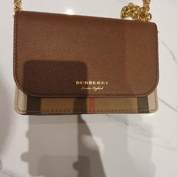 Genuine Burberry Crossbody/Clutch Bag, leather combined with the signature Burberry house check. Gold hardware and Leather strap.
Comes with the original dust bag - bought from Burberry. I am only selling since no longer need or use.
Perfect condition no marks or flaws. Only carried one time, it is still like new..
100% genuine.
Feel free to ask any questions.