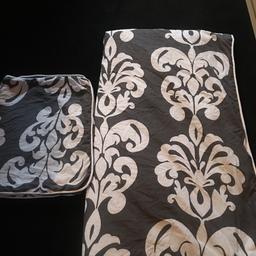Lovely and unusual double duvet set. It’s white and grey with white piped edging. The reverse is just plain grey which had hardly been used with no rips or marks and comes from a clean and smoke free home.