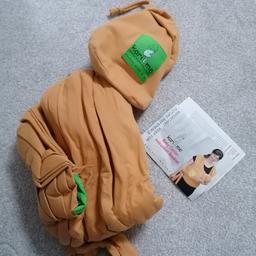 Kari me wrap style sling - can be used from birth to 15kg in a variety of carrying styles. Comes with instruction leaflet. Very good condition from smoke free home.
