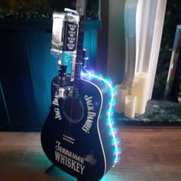 Jack Daniels guitar bar .bar Optics bottle opener. remote-controlled multifunction lightsand remote control. perfect for man cave .shed. Lounge bottle and stand not included. its on another bidding site if you want to bid.