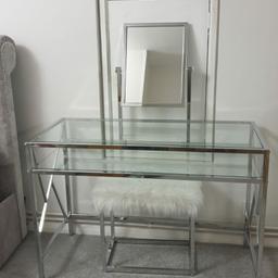 like new dressing table only used for few months. almost no marks.
chrome frame with glass top and shelf with mirror and matching stool.
was £300 new.
selling as we are moving home.
