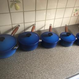 Set of five cast iron saucepans with wooden handles and all have lids.

One smaller saucepan has visible damage but others are good condition and clean - see both photos

Buyer must collect from Hempstead ME7