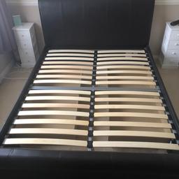 Brown leather king size bed frame with a drawer each side