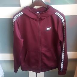 Nike zipped jacket in a wine colour size large boys  147 - 158 cm.  excellent condition from smoke and pet free home.